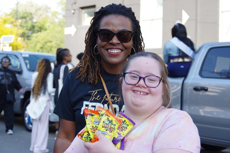 community marches in homecoming parade