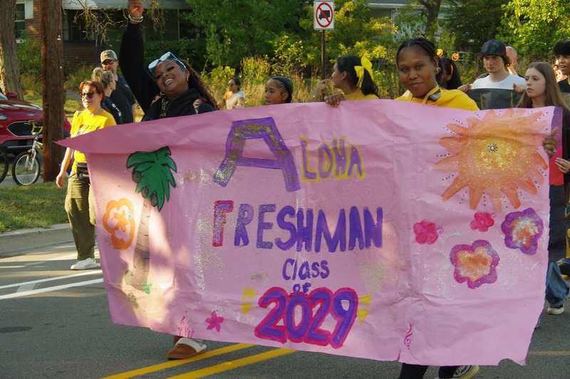 community marches in homecoming parade