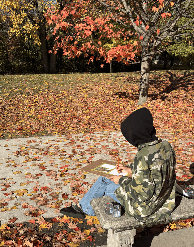 Students use watercolors to paint colorful fall leaves in the Ferndale High  School courtyard