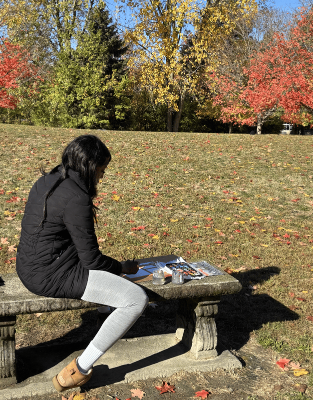 Students use watercolors to paint colorful fall leaves in the Ferndale High  School courtyard