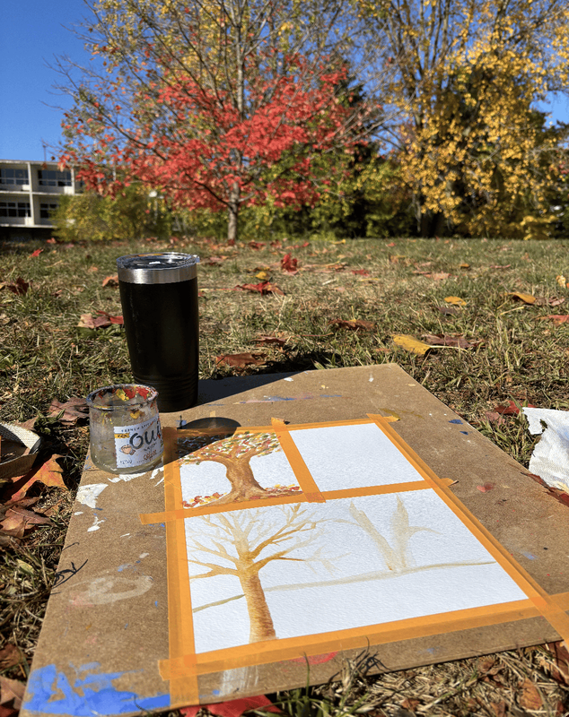 Students use watercolors to paint colorful fall leaves in the Ferndale High  School courtyard
