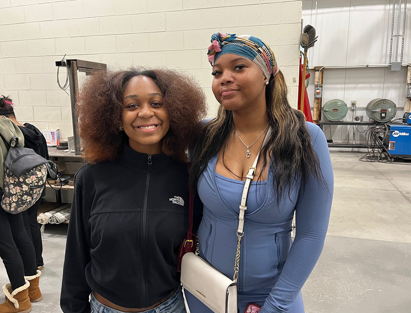 two students smile during their career training field trip