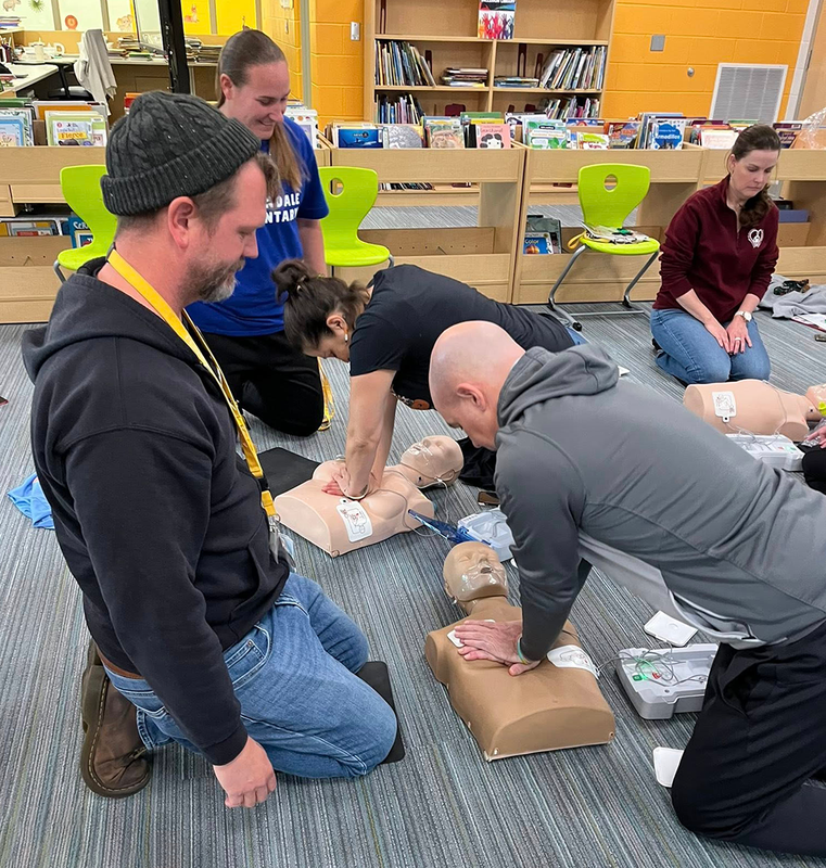 staff practices CPR techniques