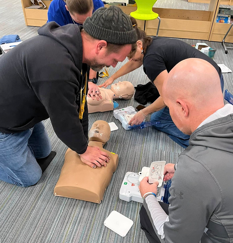 staff practices CPR techniques