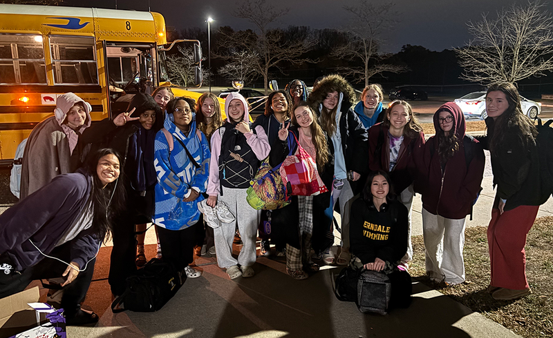 Girls Swim Heads to Competition on the bus