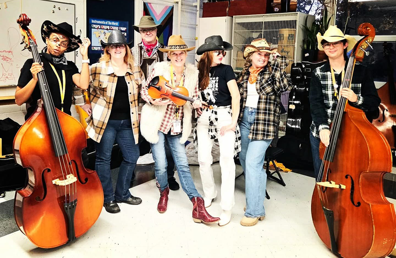 staff dressed up for costume contest on halloween