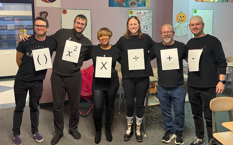 staff dressed up for costume contest on halloween