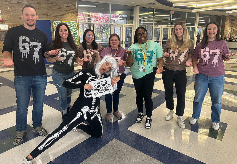 staff dressed up for costume contest on halloween