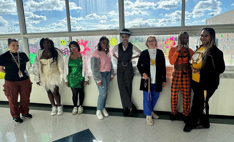 staff dressed up for costume contest on halloween