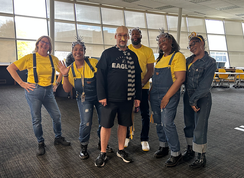 staff dressed up for costume contest on halloween