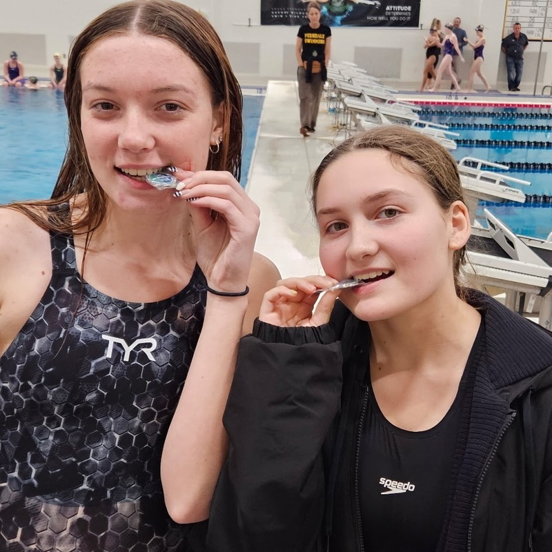 champs bite their medals