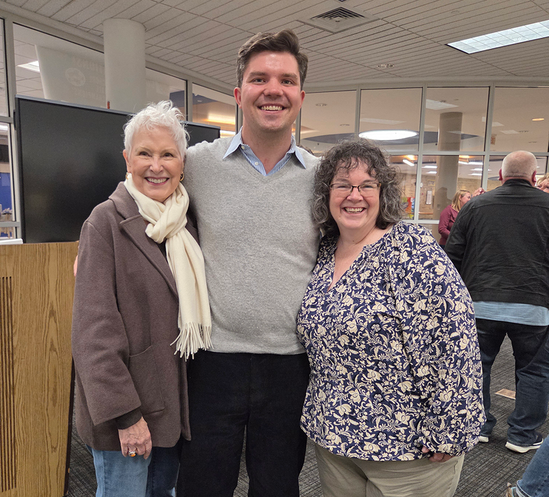 neurodiverse folks pose with family