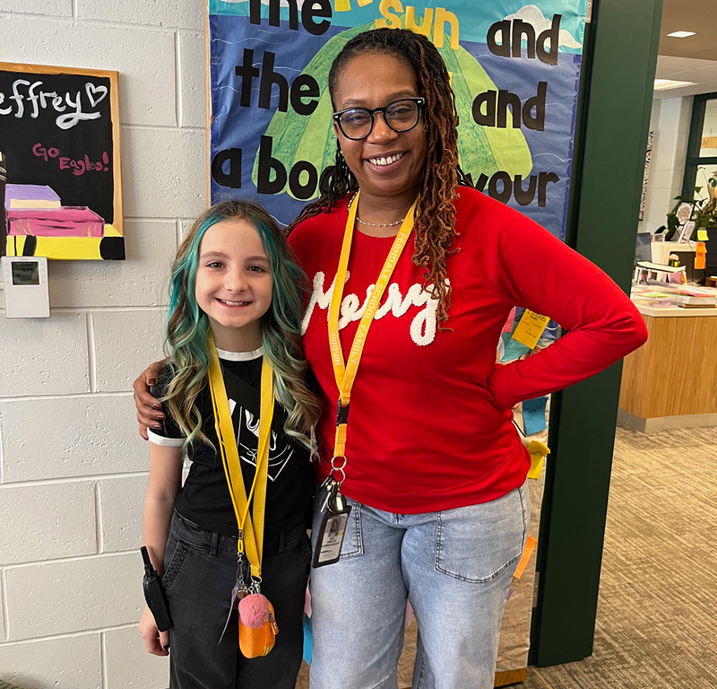 Student takes on Principal role for the day, beside Superintendent Hibbler