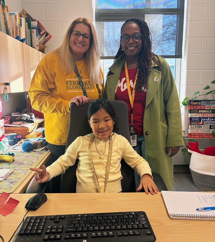 Student takes on Principal role for the day, beside Principal Keefe and Superintendent Hibbler