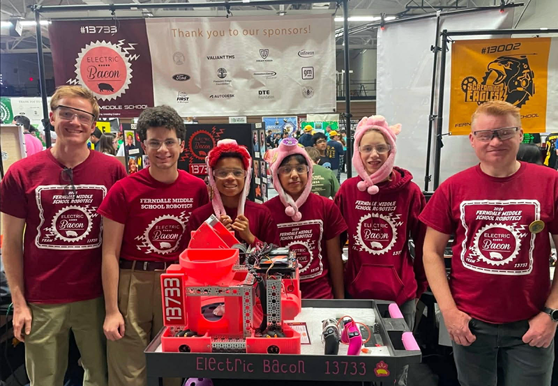 electric bacon team poses