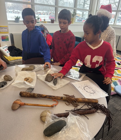 students explore historical hunting tools