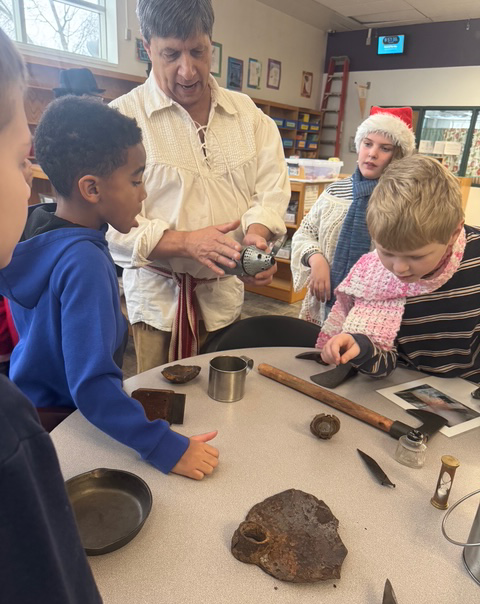 students explore artifacts