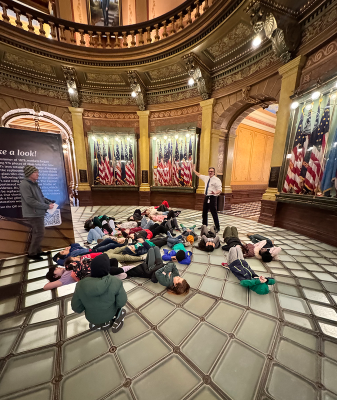 students gaze up at the dome of the capitol in Lansing