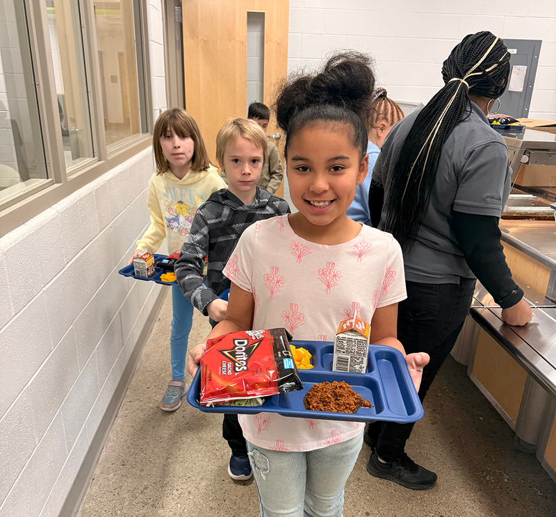 students use new hi-durability reusable lunch trays.