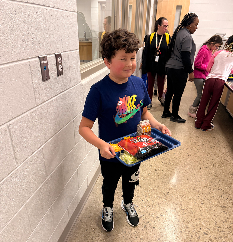 students use new hi-durability reusable lunch trays.