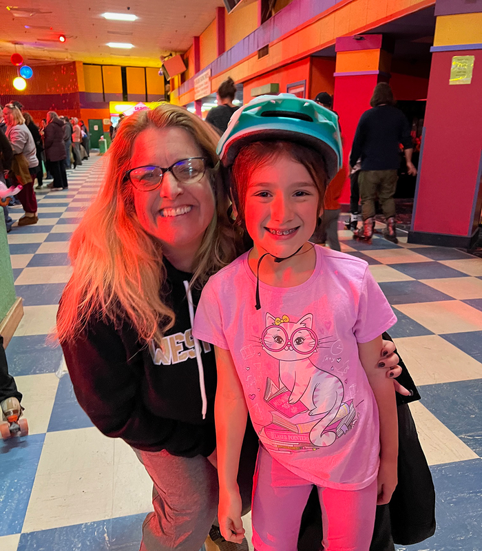 Principal Keefe and a student enjoy Elementary Skate Night 2026