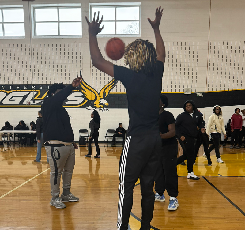 Students play basketball during Wellness Day at UHS