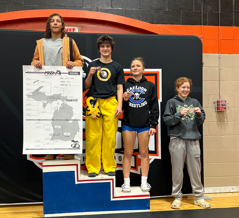 FHS Girls Wrestling celebrates victory.