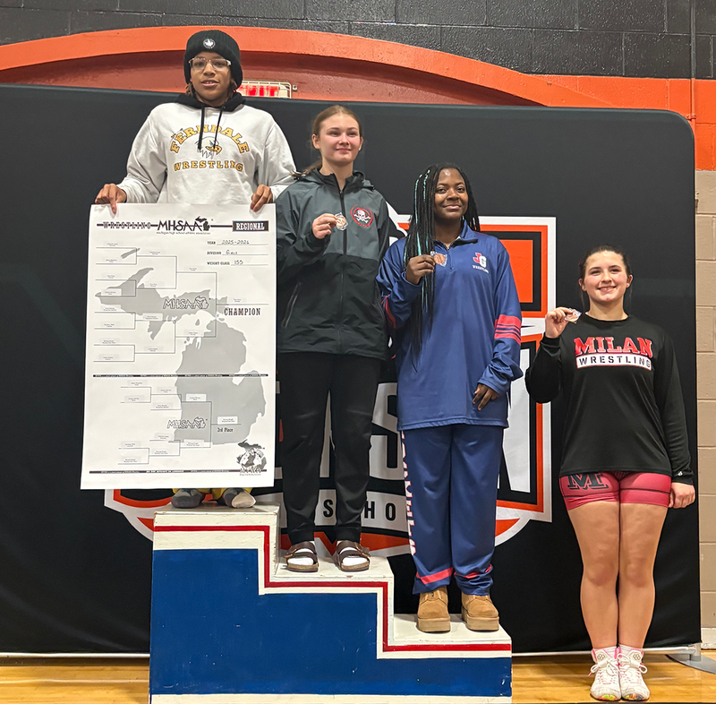 FHS Girls Wrestling celebrates victory.