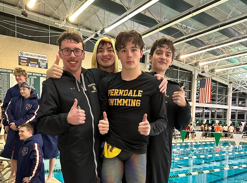 Swim Team celebrates a victory