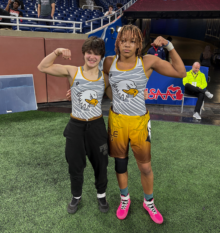 Two All-State FHS Girls Wrestling champions pose at Ford Field