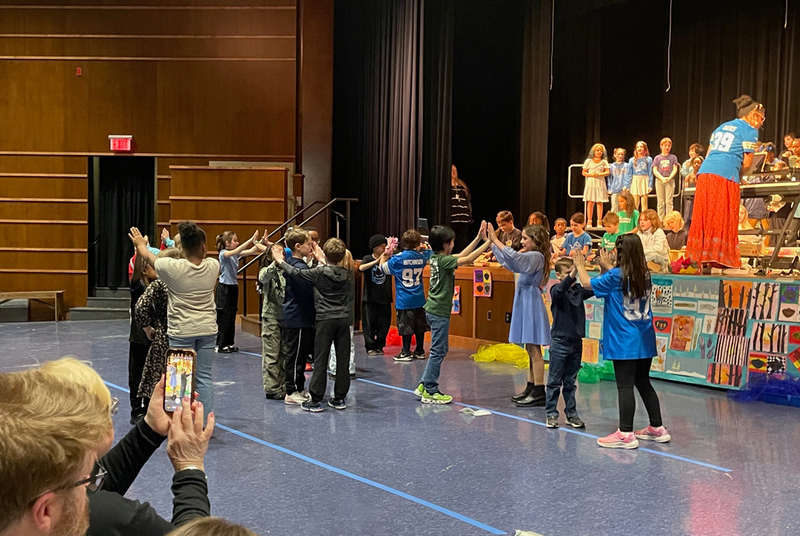 Elementary students danced and sang