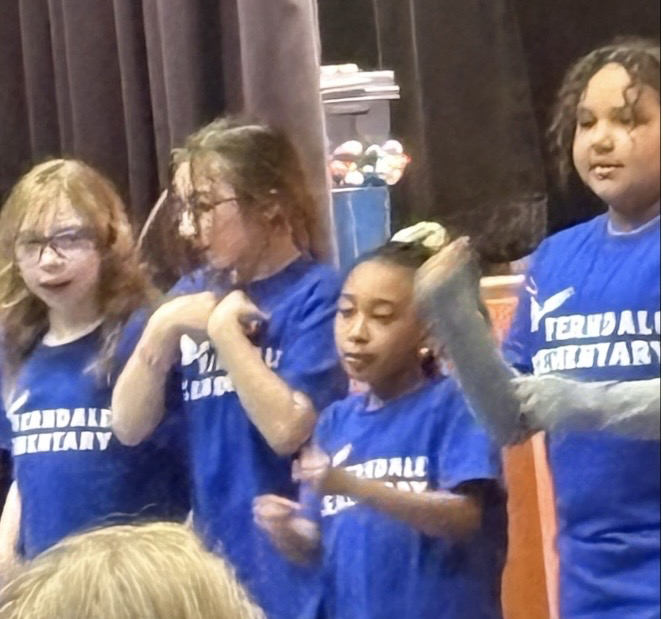 Elementary students danced and sang