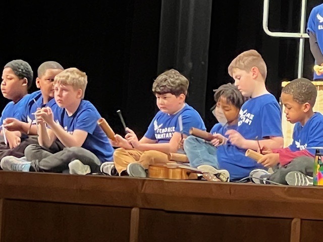 Elementary students danced and sang