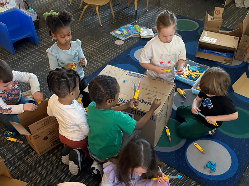 students build with kid-friendly carving tools called Makedo