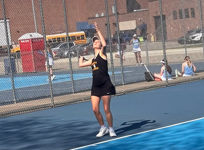 girls tennis plays a match