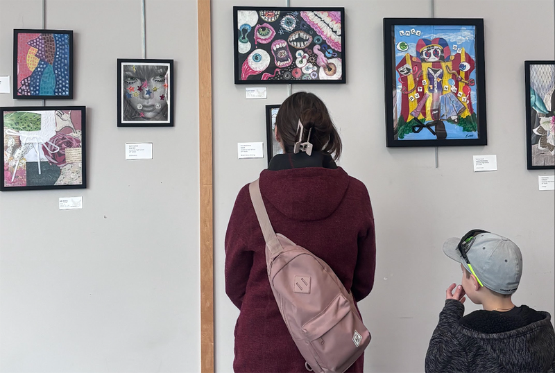 families view student art from UHS Art Club