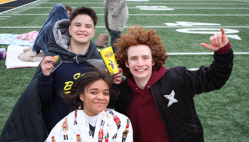 seniors chill on the field for Senior Sunset