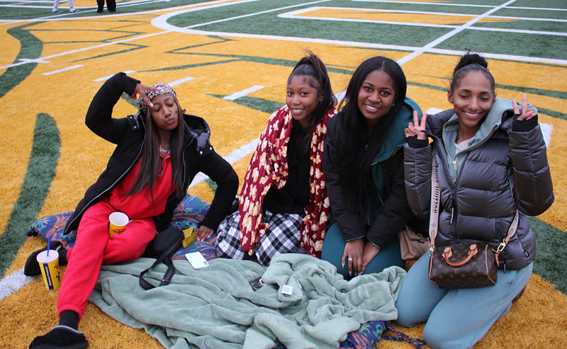 seniors chill on the field for Senior Sunset