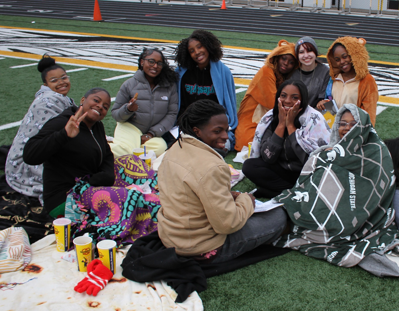 seniors chill on the field for Senior Sunset