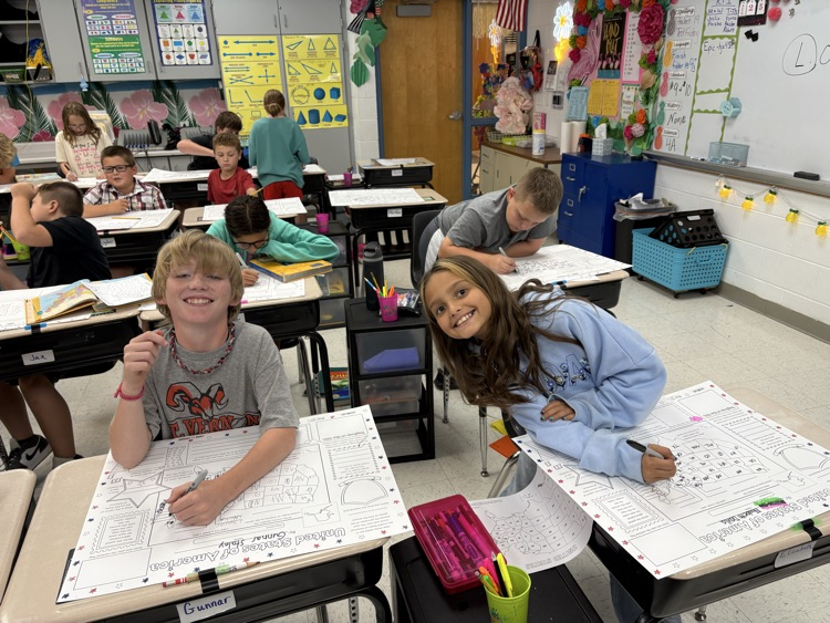 Mrs. Miller’s 5th grade having a good time together working on their USA posters last week  