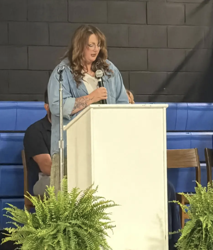 Katrina Sluder giving alumni speech to class of 2026