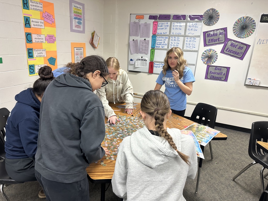 High School students working on a puzzle as a part of their class competitions.