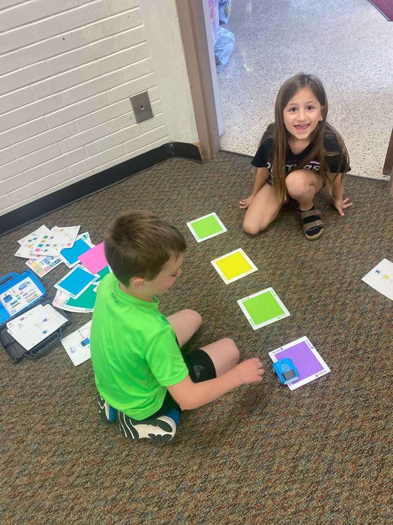 First graders learn from NPPD about computer programming.