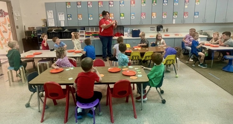 Kindergartners learn about pumpkins.