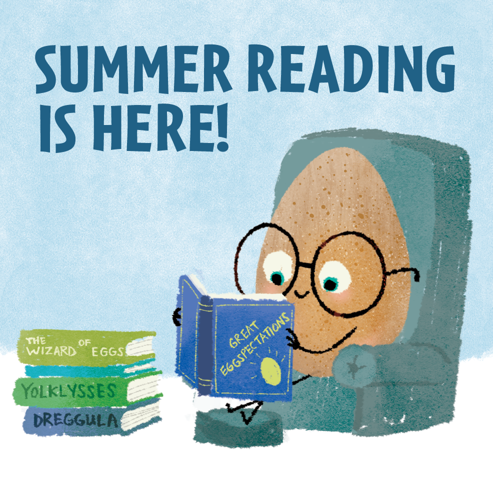 The Good Egg sitting in a chair reading with a pile of books.