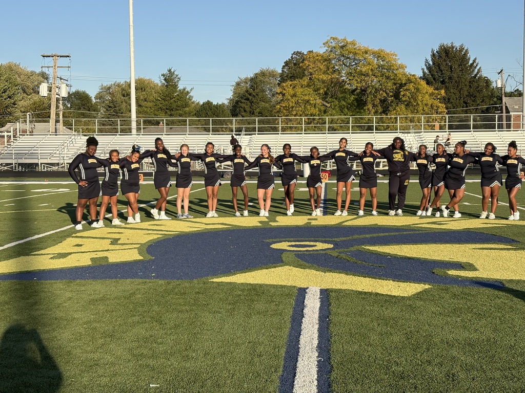 Chatterton cheerleaders around the Spartan logo