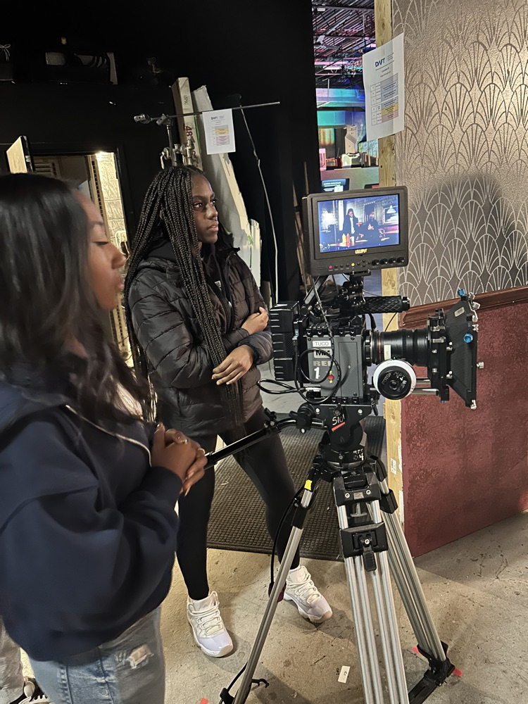 students operate the camera 