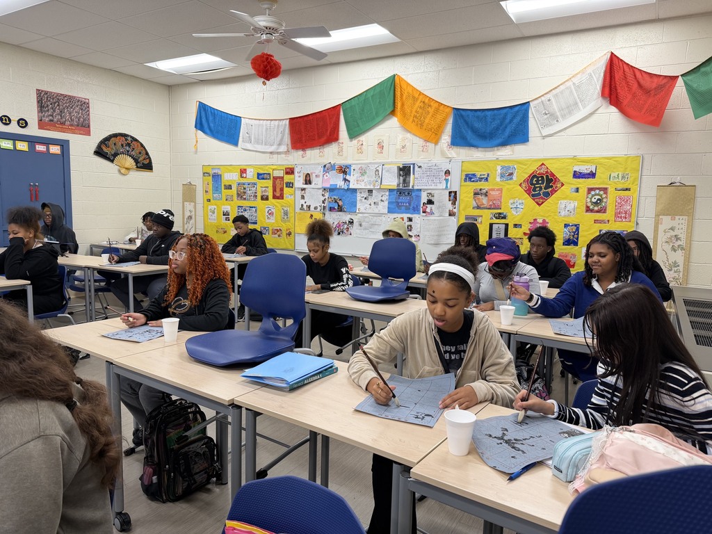FHS students try out calligraphy in class.
