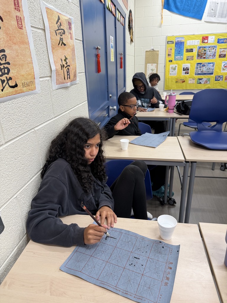 FHS students try out calligraphy in class.