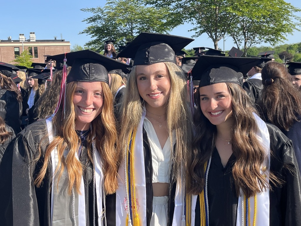 students in graduation attire outside